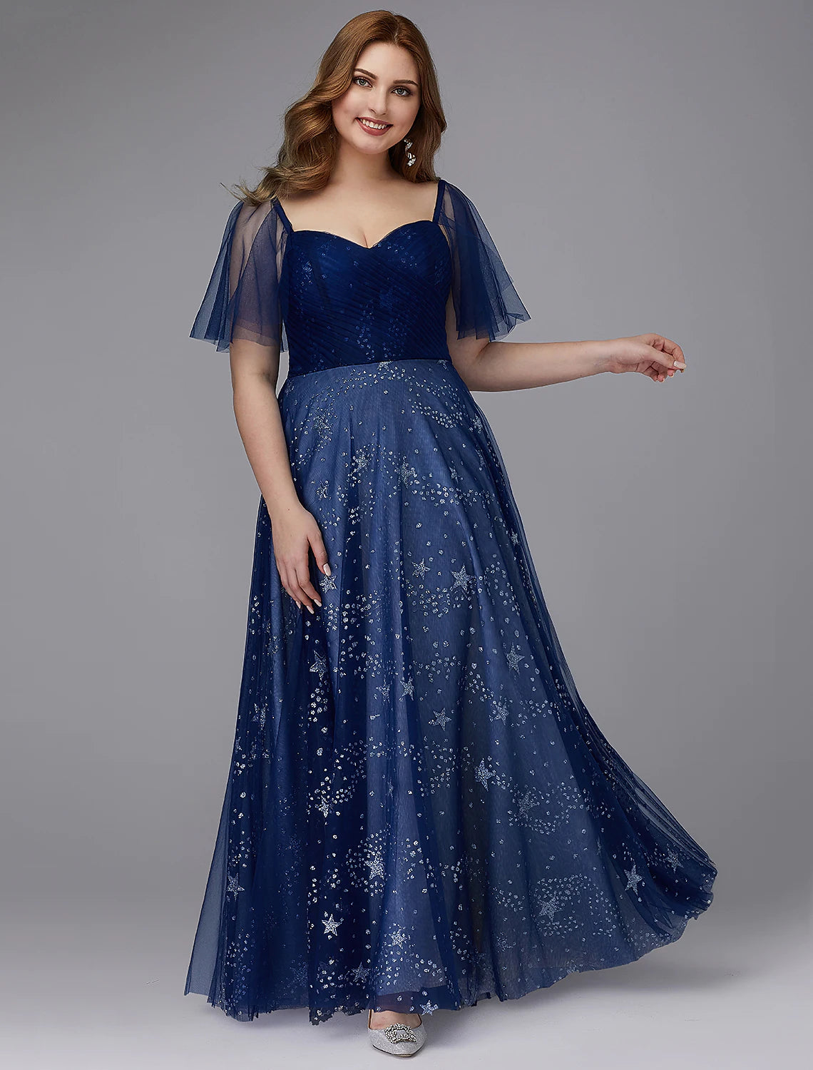 Elegant A-Line plus size prom gown with sweetheart neckline and short sleeves.