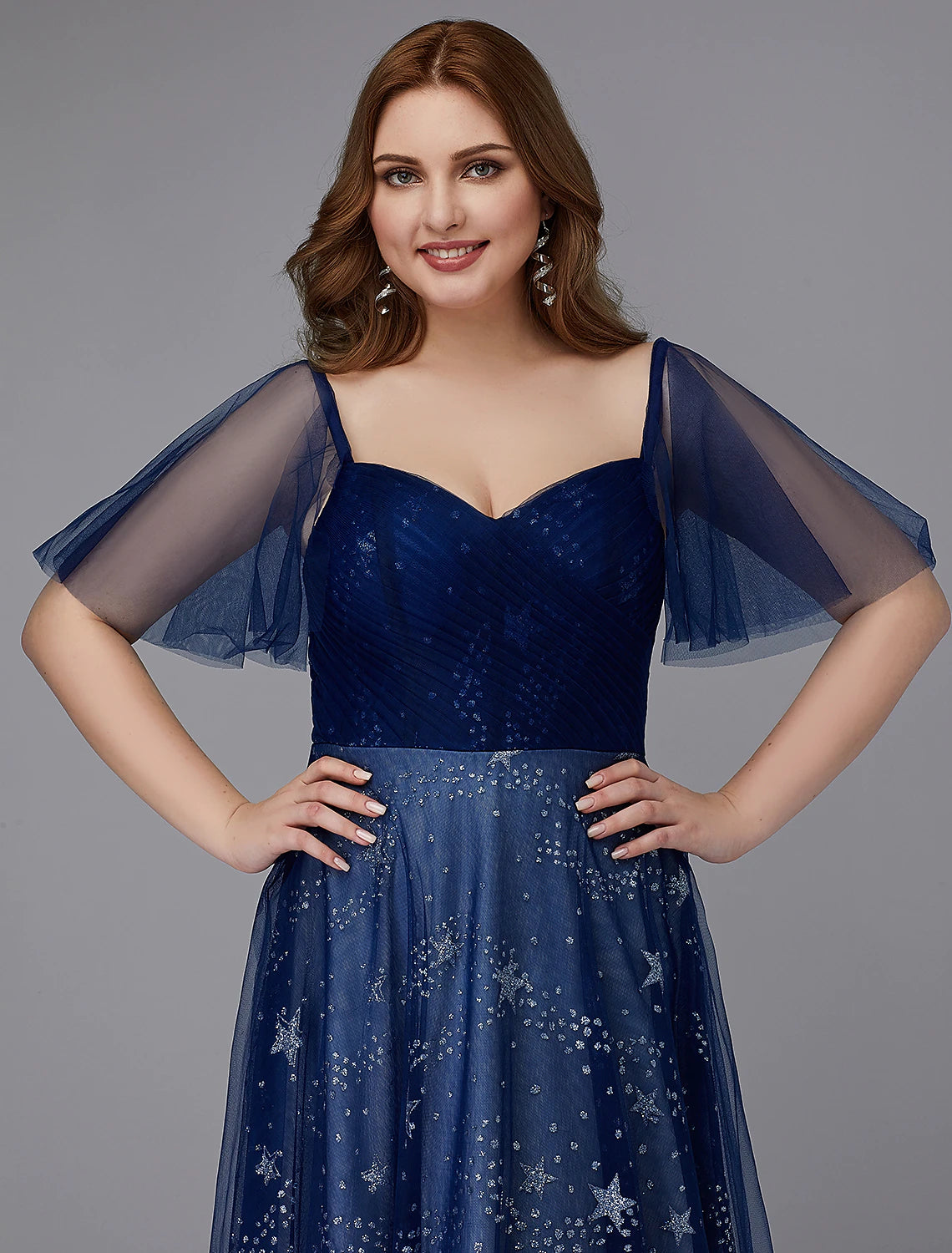 Close-up of beaded detail on A-Line plus size prom gown.