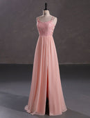 Elegant A-Line spaghetti strap evening gown with sequin slit.