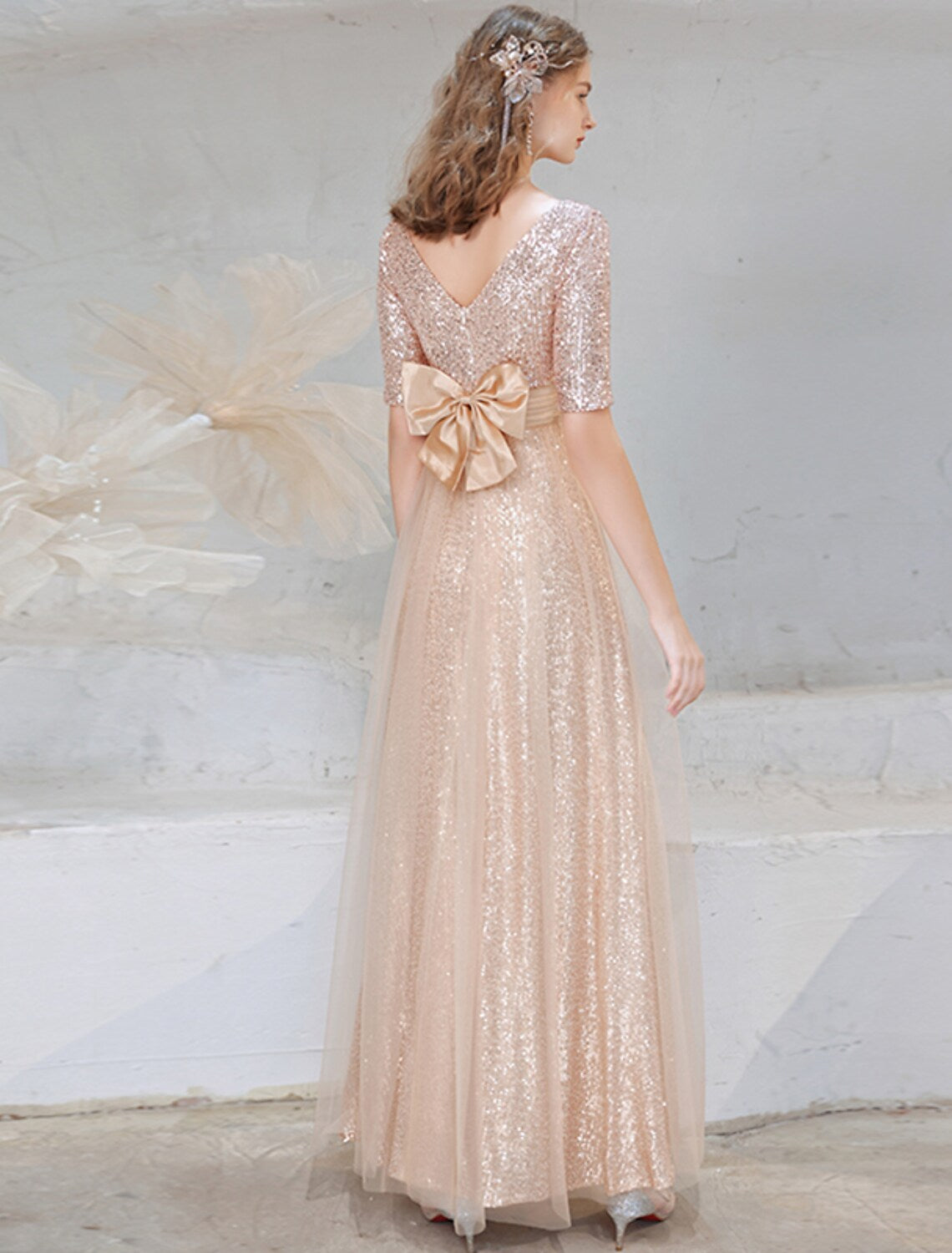 Full view of elegant A-line sequined evening gown with V-neck and half sleeves.