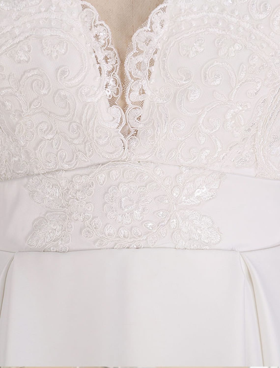 Side view of elegant A-Line satin wedding dress with long sleeves and court train.