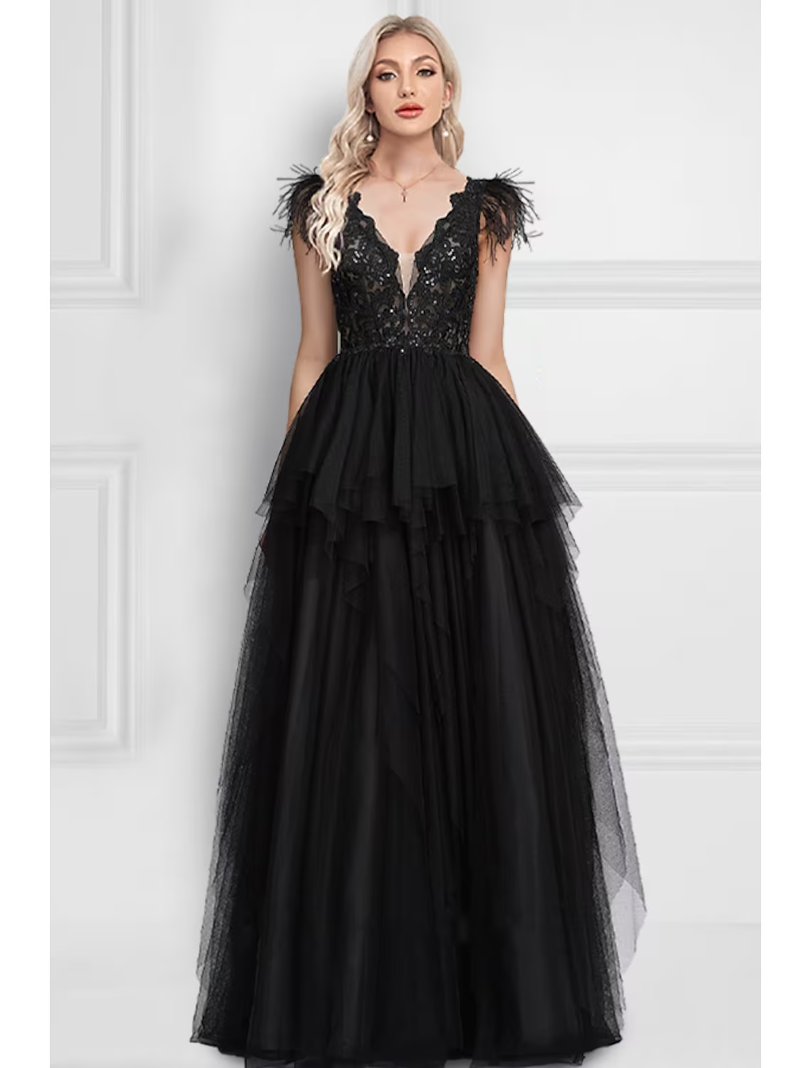 Elegant A-Line black prom dress with V-neck and feather appliques.