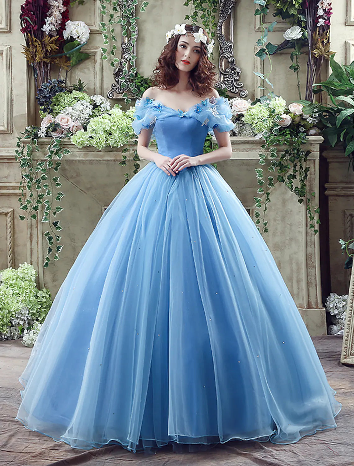 Elegant off-shoulder satin ball gown with short sleeves, appliques, and a chapel train.