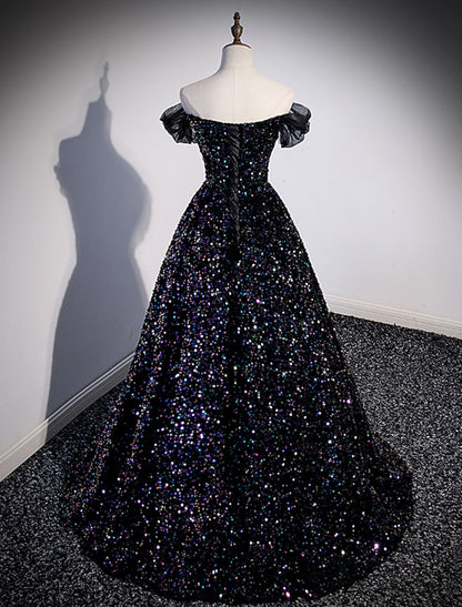 Back view of a sequined ball gown with a graceful court train.