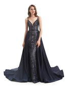 Woman wearing an elegant detachable sequin mermaid trumpet evening gown.