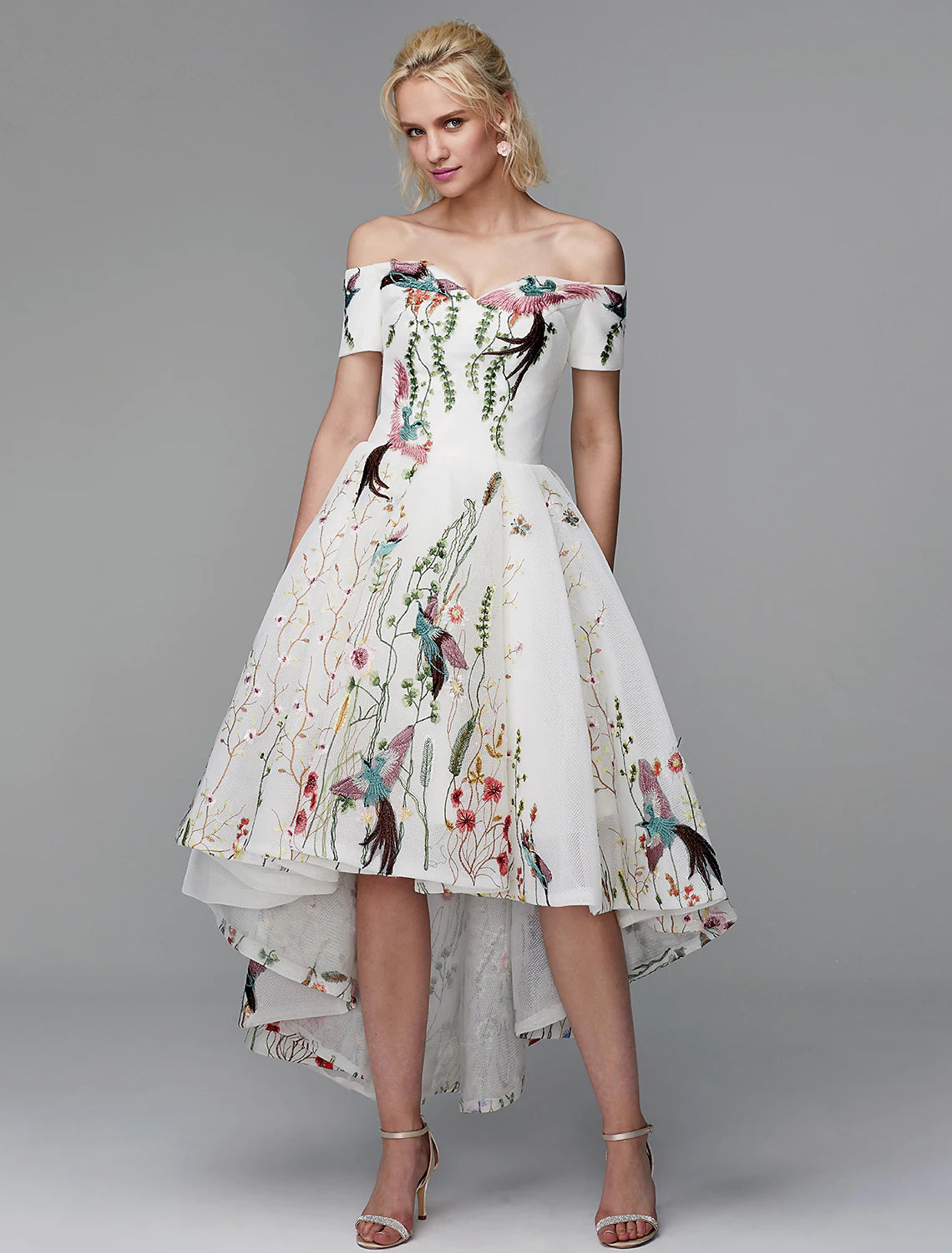 Elegant embroidered ball gown with off-shoulder short sleeves, front view.
