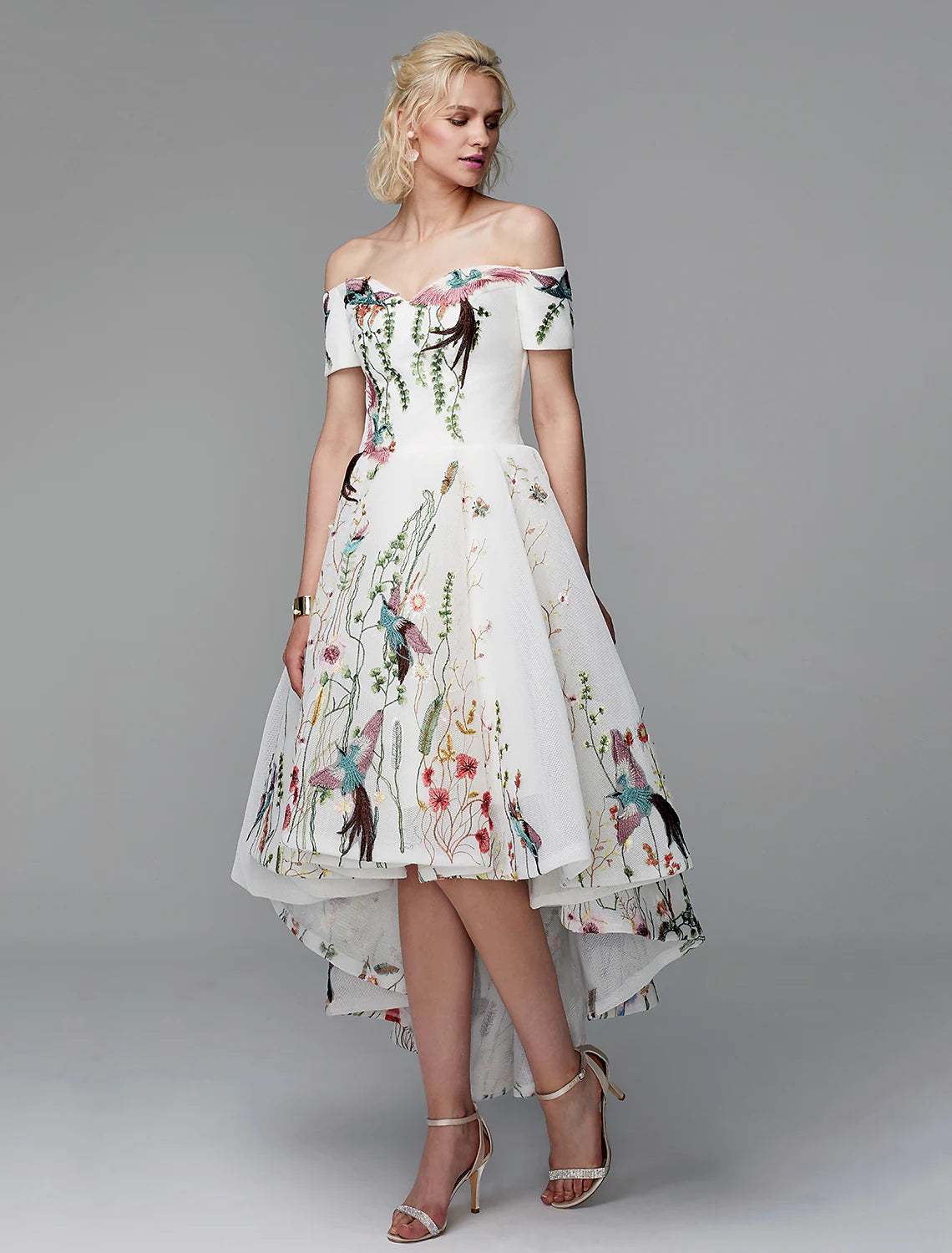 Close-up of intricate embroidery on the elegant ball gown fabric.