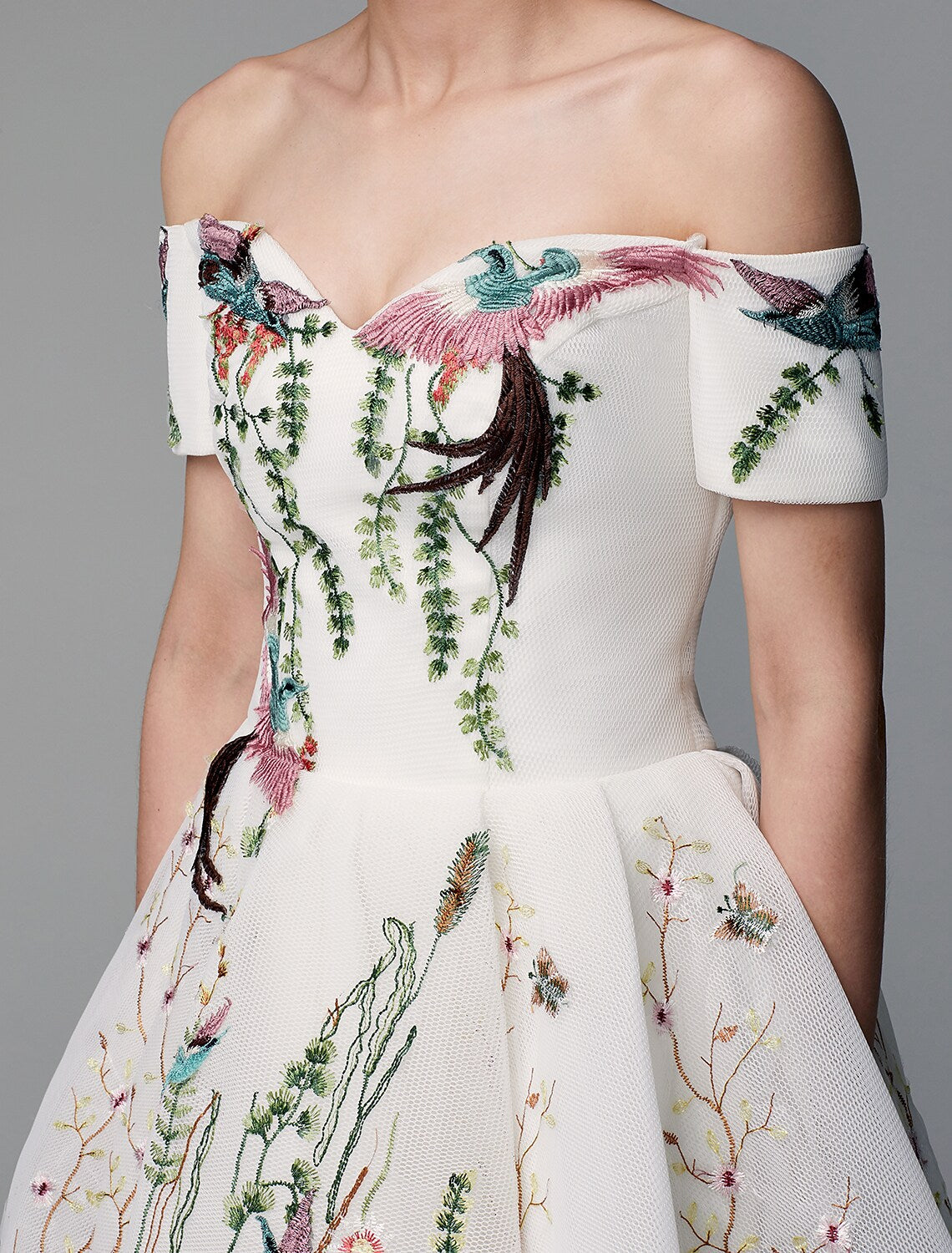 Full length view of the elegant asymmetrical ball gown dress.