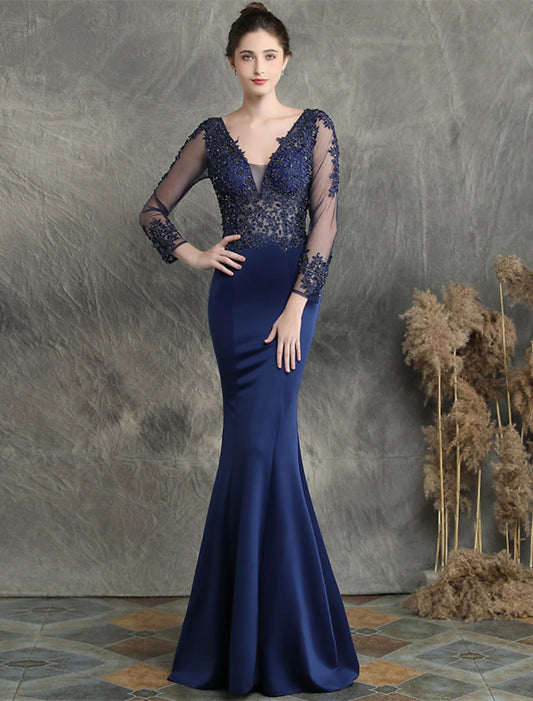 Mermaid prom dress with V-neck, long sleeves, and intricate beading details.
