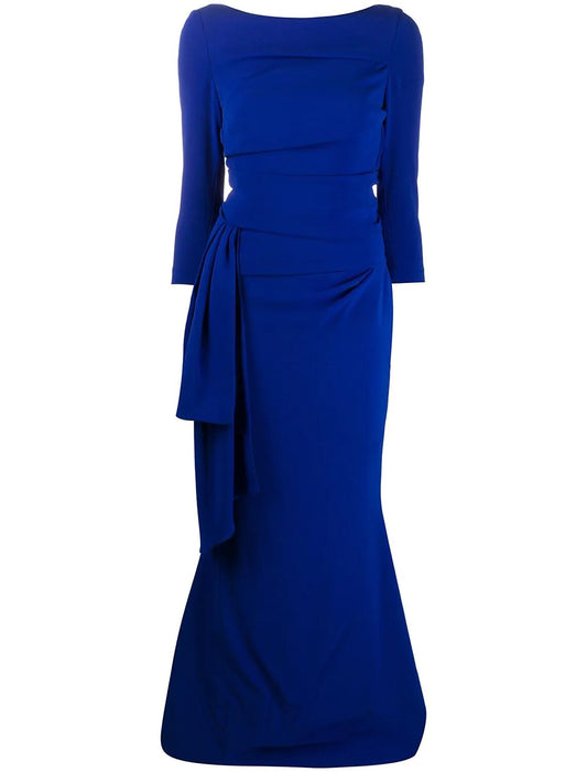 Elegant woman in a front view of a ruched mermaid trumpet evening dress with 3/4 sleeves.