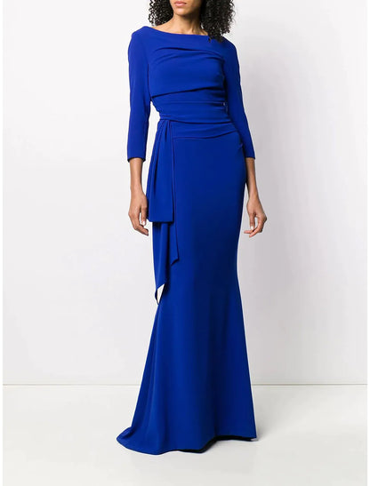 Woman posing in a side view of a scoop neck mermaid trumpet formal dress.