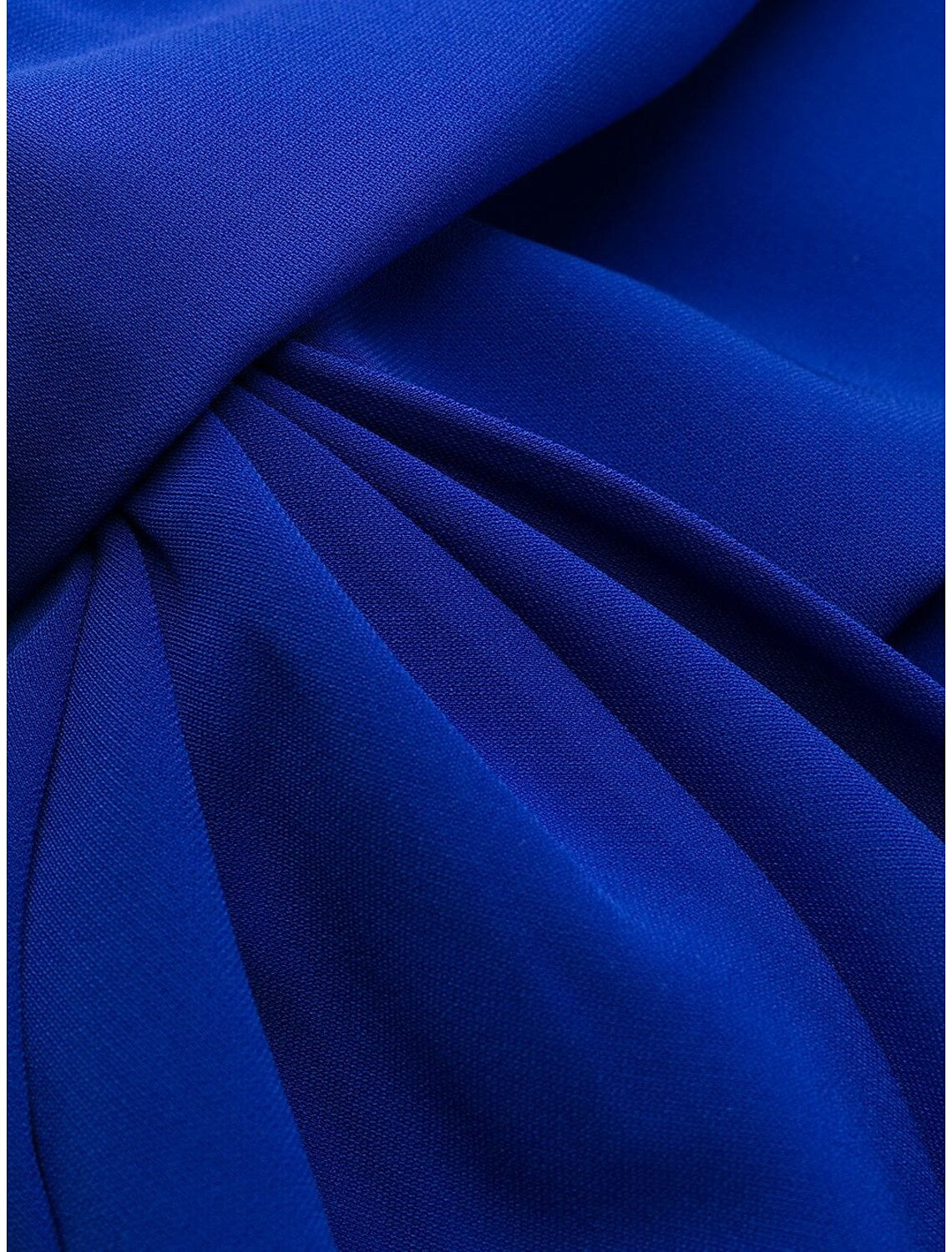 Back view of a woman wearing a sophisticated ruched mermaid trumpet evening gown.