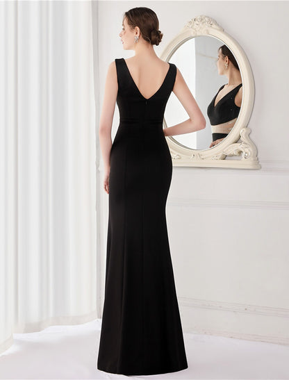 Front view of a mermaid V-neck evening gown showcasing the high slit.