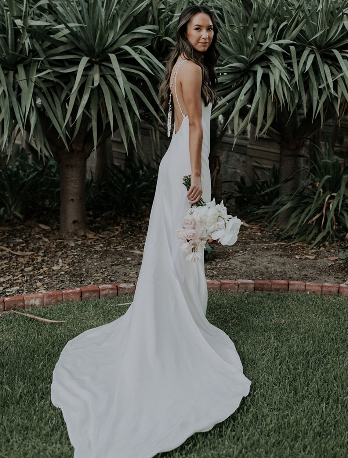 Elegant Mermaid V-Neck Spaghetti Strap Open Back Wedding Dress with Pearls.