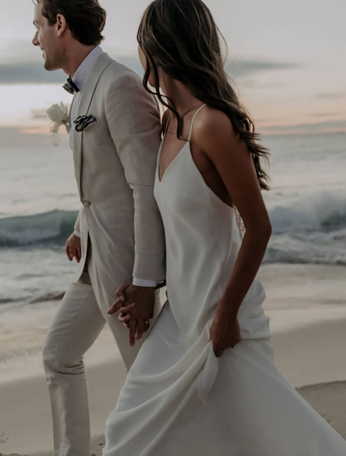 Elegant Mermaid V-Neck Spaghetti Strap Open Back Wedding Dress with Pearls.