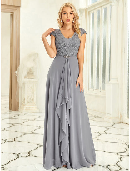 Full length view of a pleated off-shoulder prom dress with sweep train.
