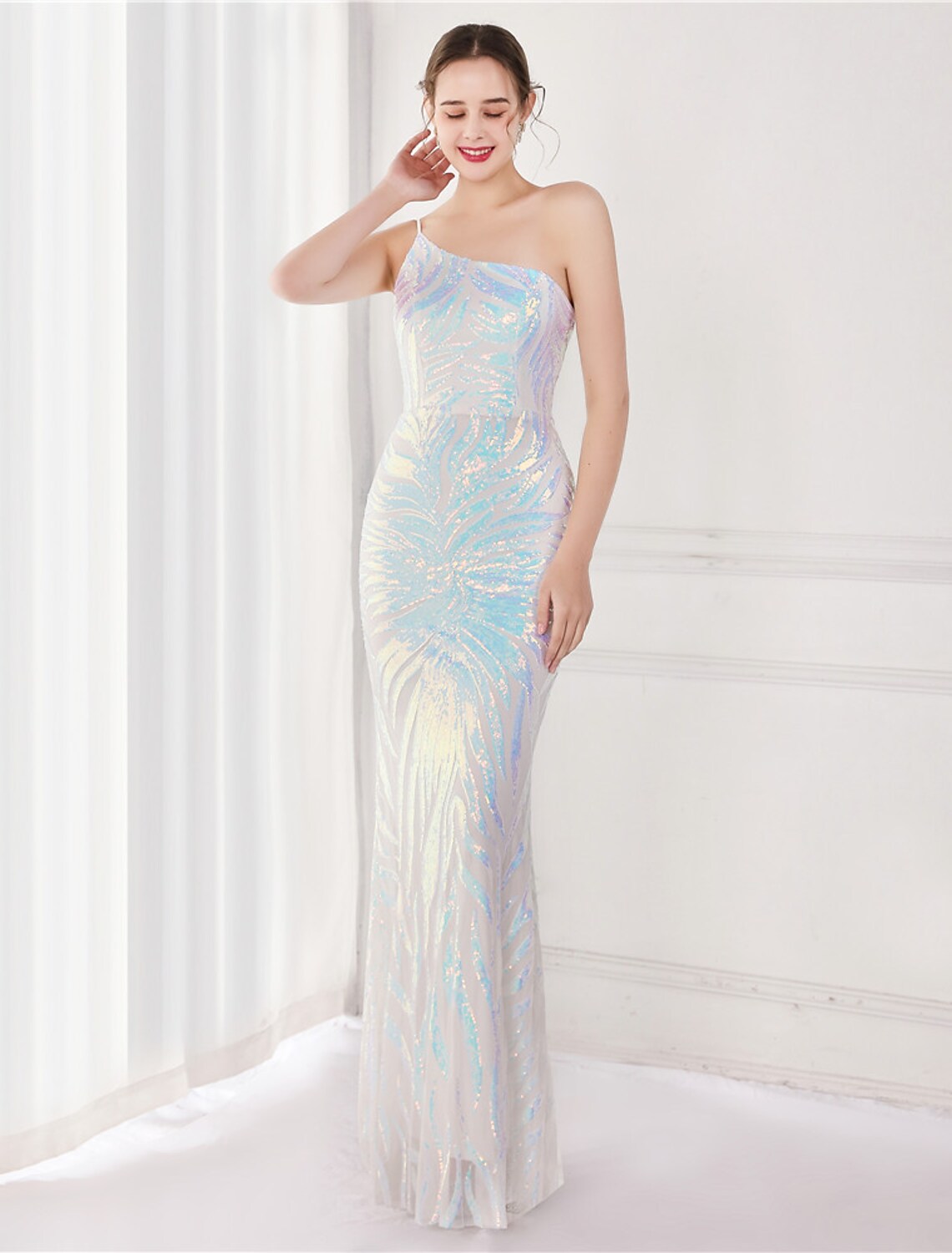Close-up of the sequin detail on the elegant one-shoulder mermaid trumpet evening gown.
