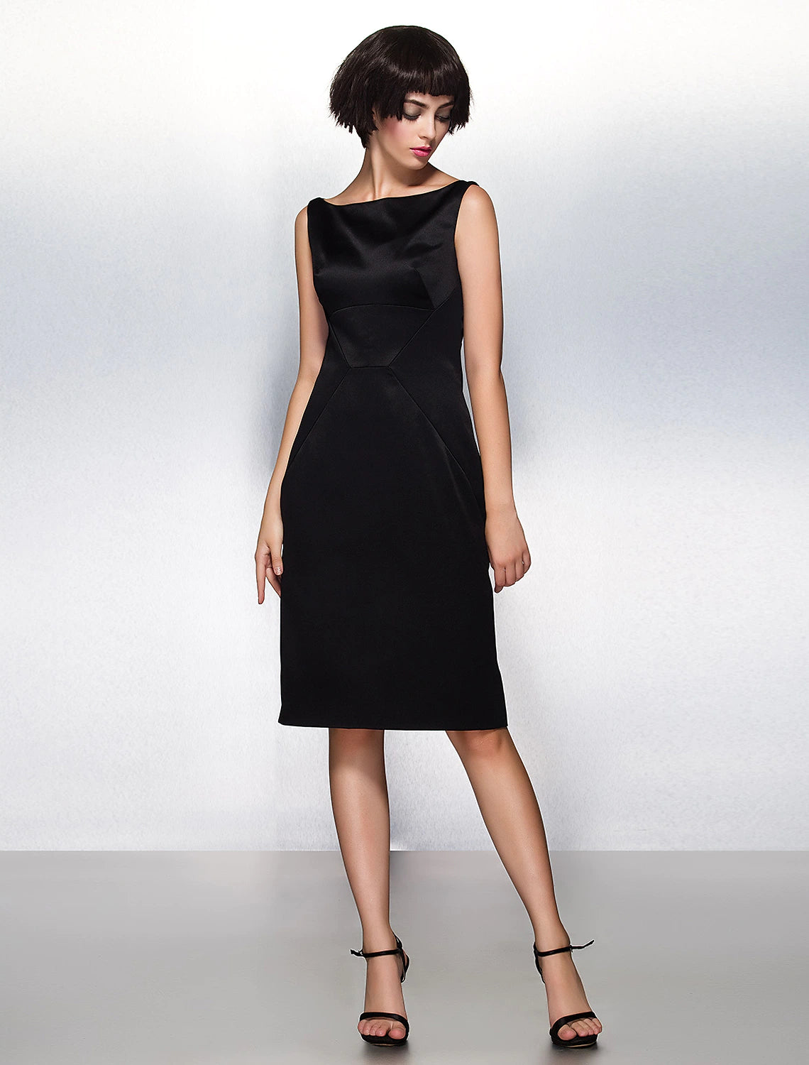Side view of Elegant Sheath Bateau Neck Pleated Satin Knee-Length Party Dress.