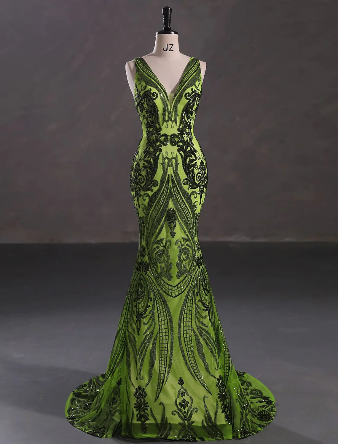 Elegant sparkling mermaid V-neck sleeveless evening gown with court train.