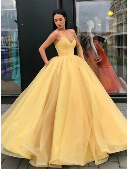 Elegant strapless ball gown with pleated tulle.