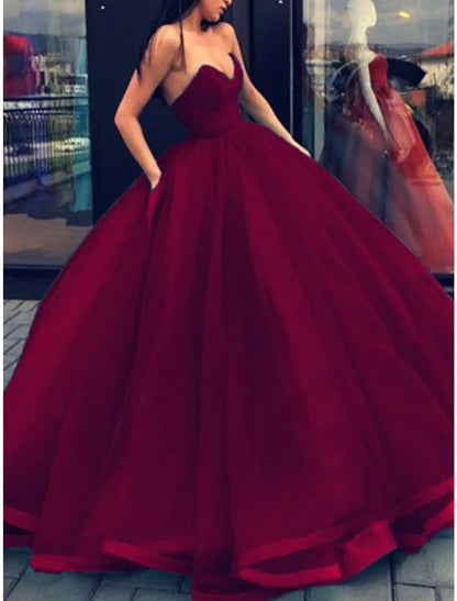Floor-length formal dress featuring a strapless design.