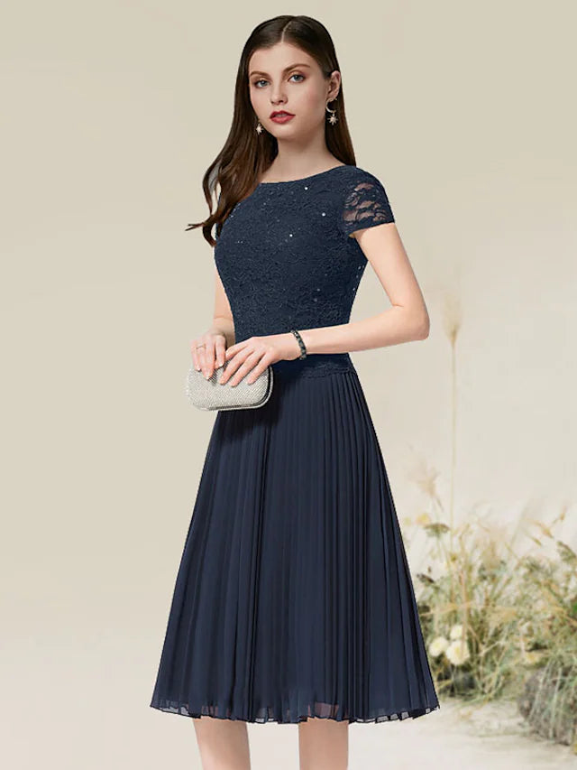 Flirty A-Line Jewel Neck Short Sleeve Pleated Chiffon Tea Length Homecoming Dress.
