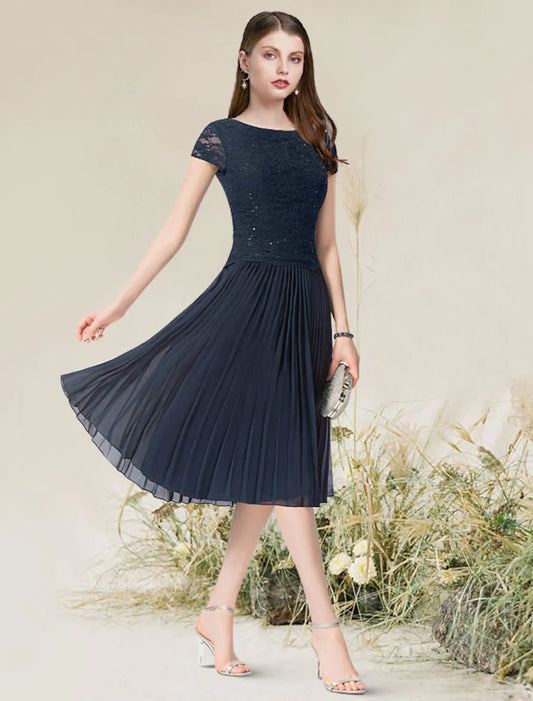 Flirty A-Line Jewel Neck Short Sleeve Pleated Chiffon Tea Length Homecoming Dress.