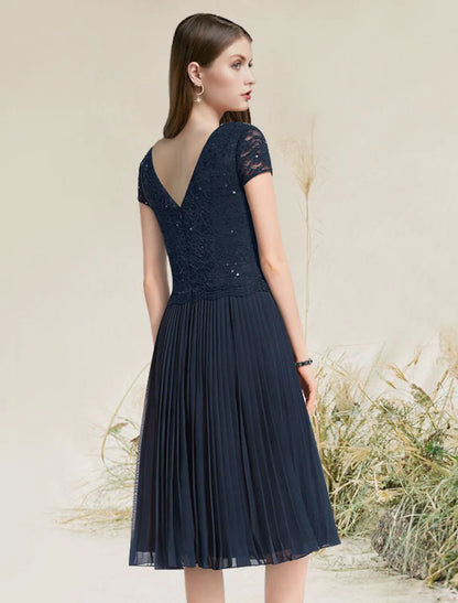 Flirty A-Line Jewel Neck Short Sleeve Pleated Chiffon Tea Length Homecoming Dress.
