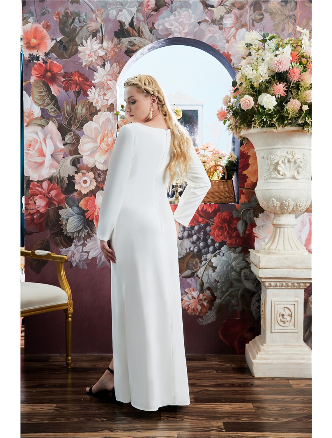 Close-up of the jewel neck and crystal details on the A-line gown.