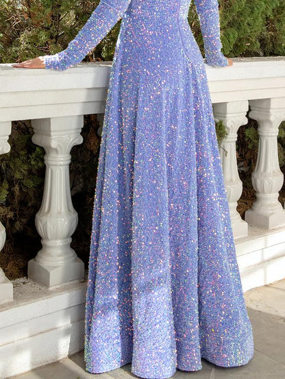 Model walking in a sparkling A-line V-neck sequined pleated floor-length prom dress.