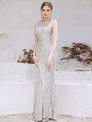 Sparkling mermaid one-shoulder evening gown with sequins and beads.