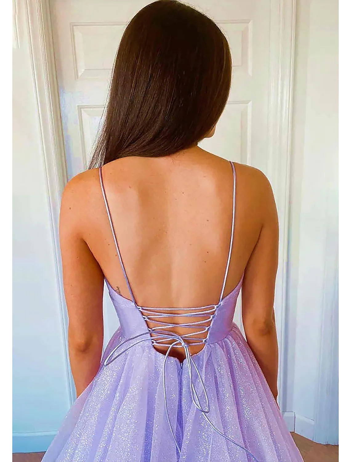 Full length view of a sparkling sweetheart ball gown prom dress.